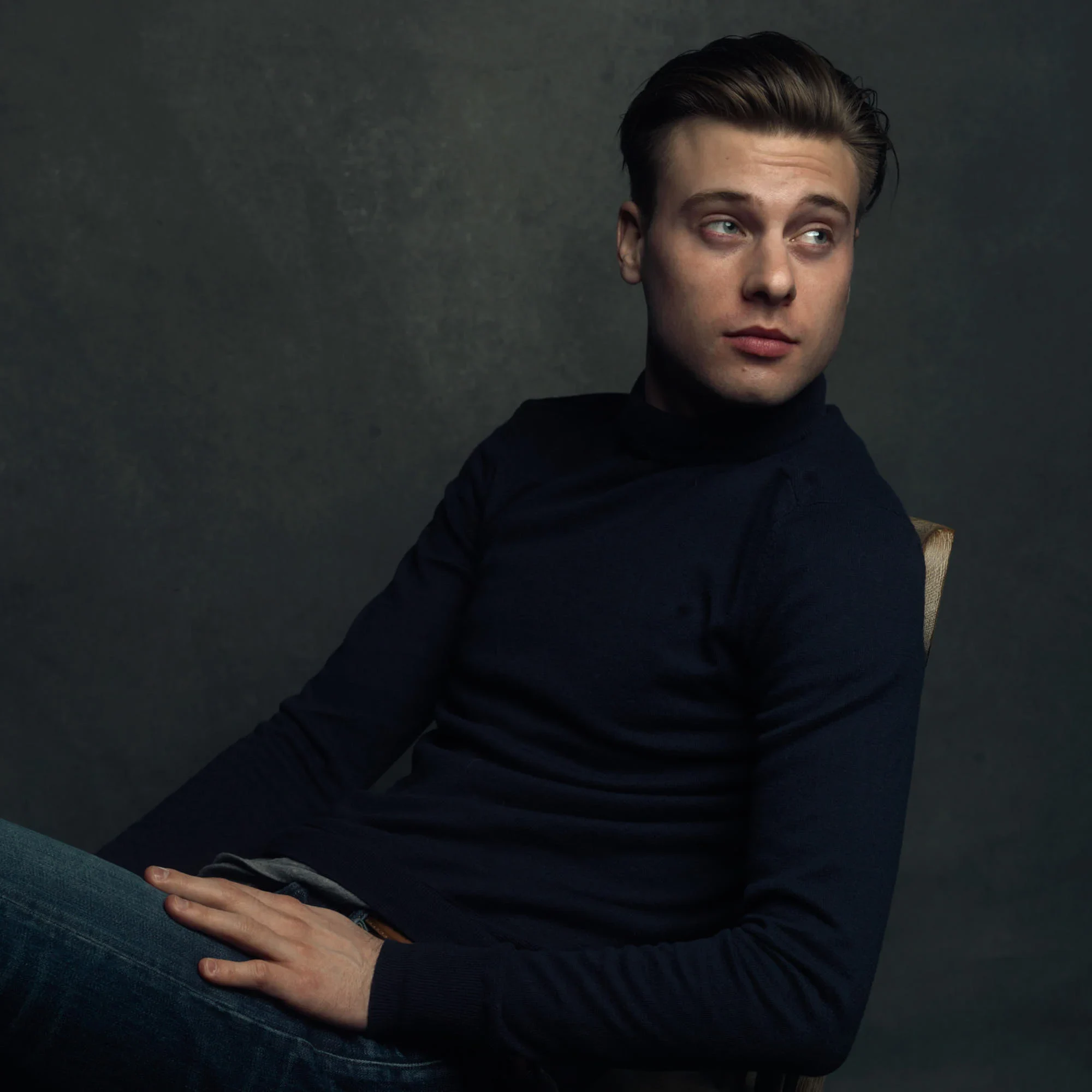 Young man photographed in chair by Chicago headshot photographer Michael Schacht of 312 Elements Headshot Photography Vanity fair portrait of young man photographed in chair by Chicago headshot photographer Michael Schacht of 312 Elements Headshot Photography inspired by Vanity Fair Magazine.